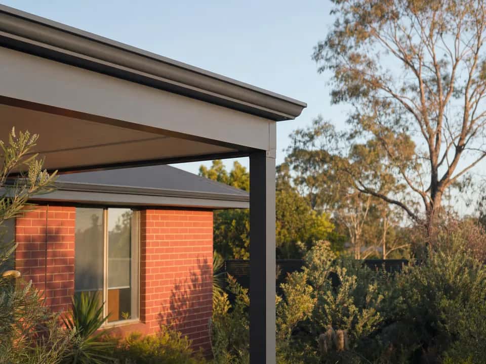 Front beam, gutter and steel post of a flat roof patio