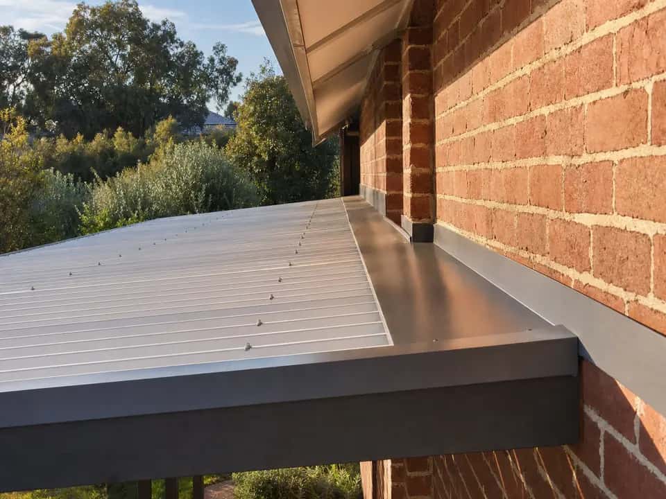 Flashing where a skillion patio roof meets the brick wall of the house