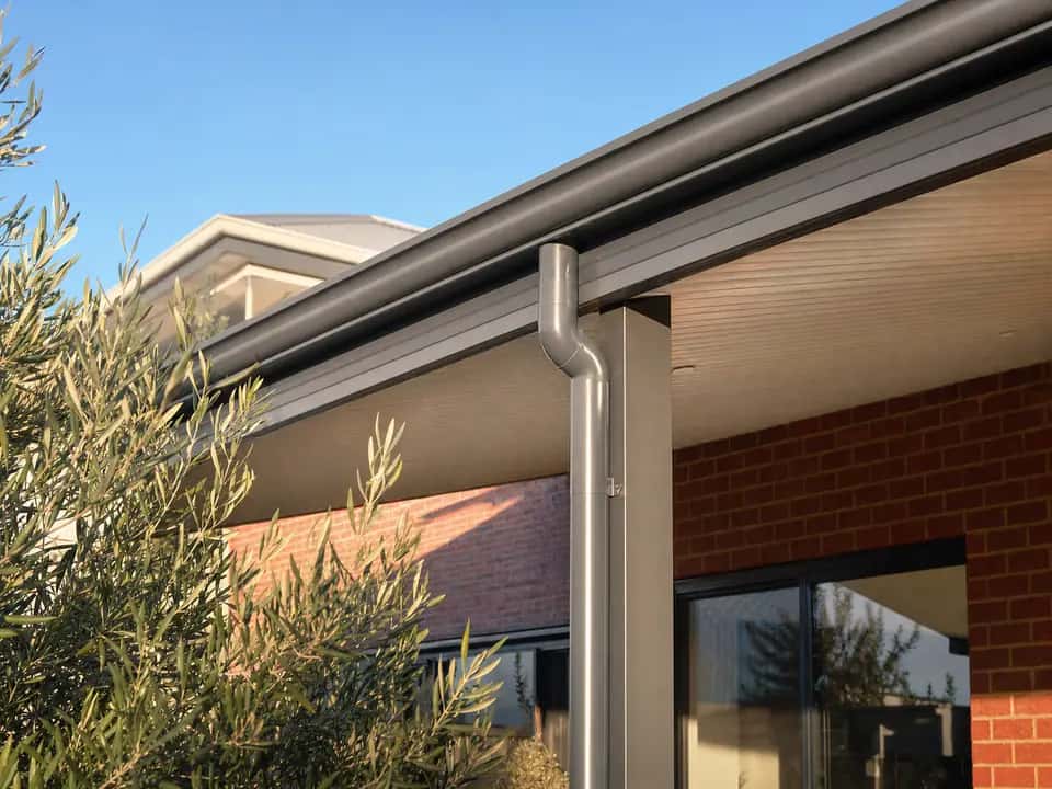 Gutter and downpipe on the low edge of a skillion patio